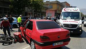 Otomobille çarpışan motosiklet sürücüsü yaralandı..